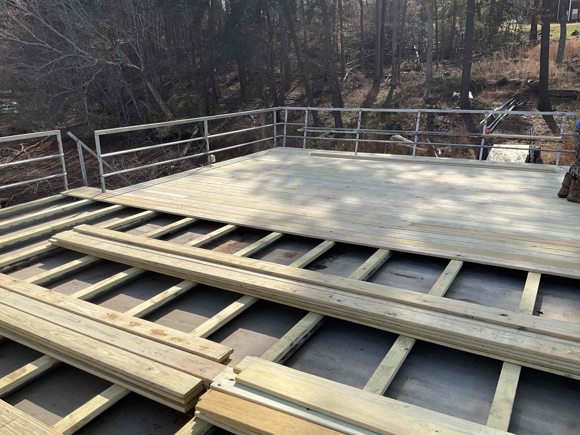 Crew installing new decking boards on Lake Lanier dock