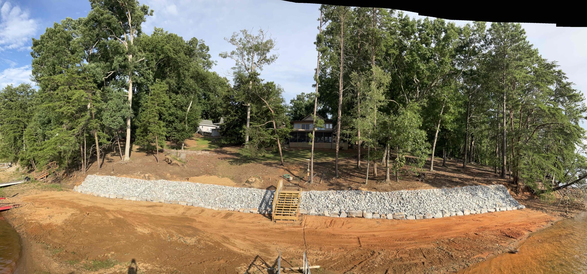 Hand-stacked granite rip rap on residential Lake Lanier shoreline after installation