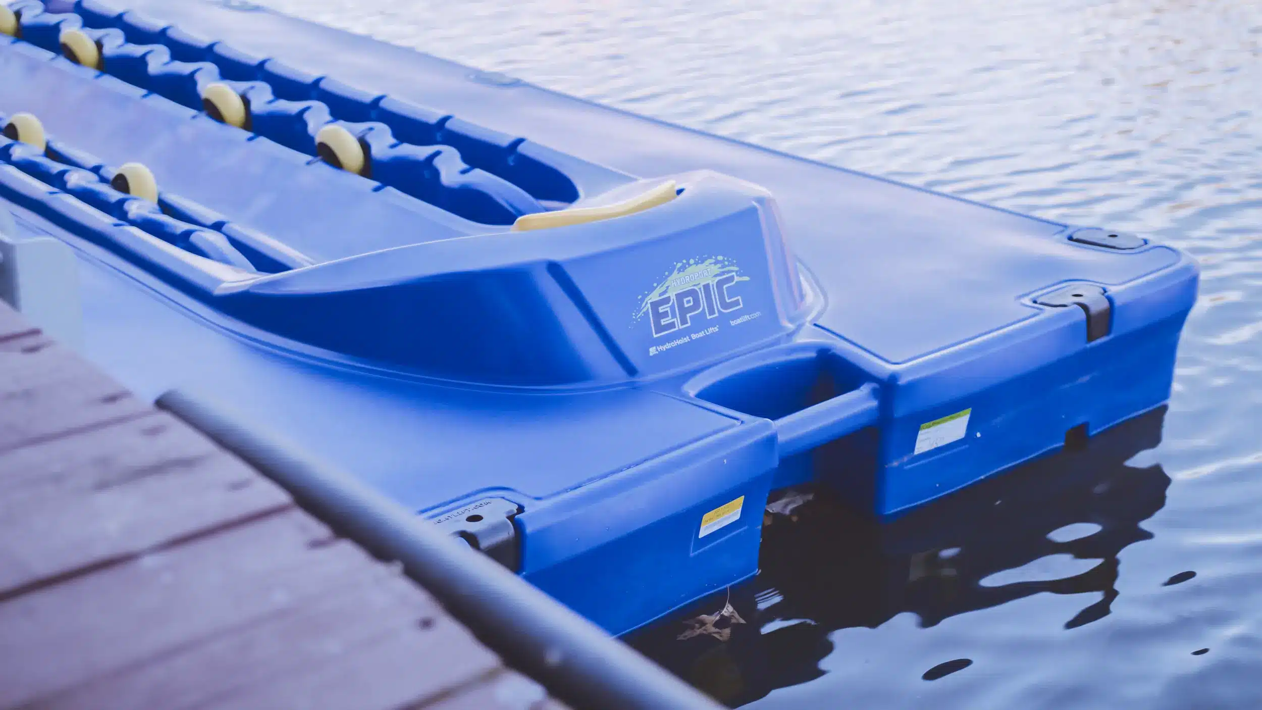 Blue HydroHoist HP Epic floating jet ski port at a dock